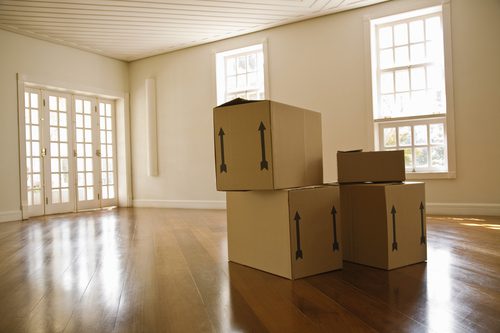 Moving boxes in empty room Moving boxes in empty room